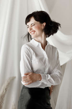 happy young woman freelancer working on computer at home. Attractive businesswoman studying online, using laptop software, web surfing information or shopping in internet storeの写真素材