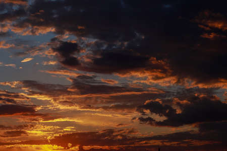 Gorgeous scenic of the sunrise or sunset with dark lining and cloud on the orange sky. Vibrant and Colorful background.の写真素材