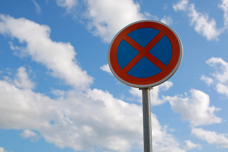 No Parking Traffic Sign. The urban clearway sign with blue sky cloudy background