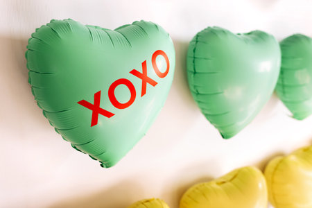 background of colorful balloons in the shape of a heart. Love concept.Holiday Object, Birthday, Valentines Day, Wedding. party decor. greeting card. heart with inscriptionsの写真素材