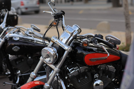 Castellon, Spain-May 21, 2022: close up of red Retro Harley Davidson motorcycles parked on the...