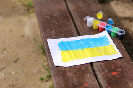 Children's drawings against the war in Ukraine. A call for peace, a drawing of the Ukrainian flag and a heart in yellow and blue color. High quality photo.の写真素材