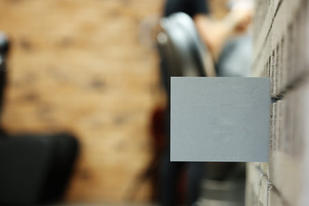 gray postcard or bossiness card with mock up on stylish barbershop or beauty salon background....