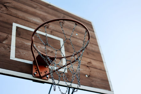close up of basketball hoop. Basketball court outdoors, metal net and backboard for basket ball game...