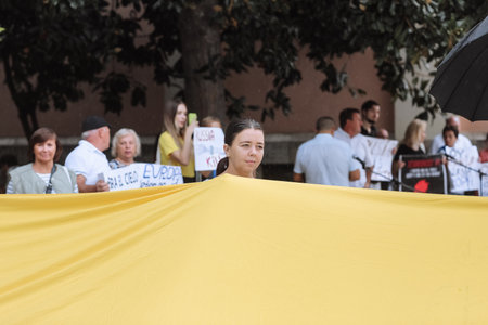 Valencia, Spain. September 18, 2022: Meeting, Ukraine War Protest. The people are holding Ukrainian flag Protest against Russian invasion of Ukraine. Some Ukraine Anti War sings and bannersのeditorial素材
