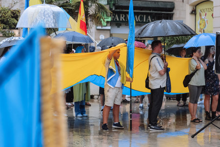 Valencia, Spain. September 18, 2022: Meeting, Ukraine War Protest. The people are holding Ukrainian flag Protest against Russian invasion of Ukraine. Some Ukraine Anti War sings and bannersのeditorial素材