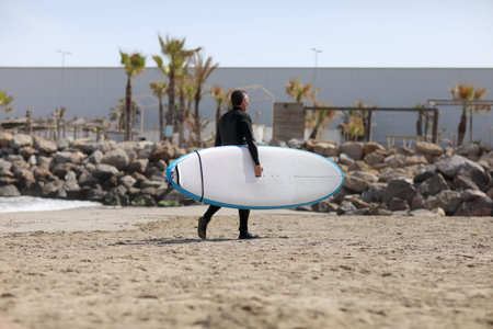 Active recreation and healthy lifestyle concept. Full length outdoor portrait of barefooted tourist...