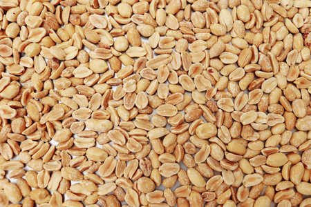close up of peeled roasted peanuts, healthy nuts, protein food. Isolated background of roasted...