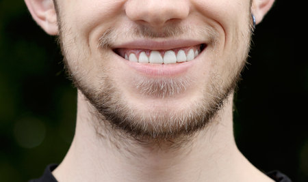 Happy Smiling man Close-up. Males Lips and white teeth. Bright Expressive Emotional Fun and Joy Lifestyleの写真素材