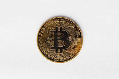 Coin gold bitcoin symbol a modern digital crypto currency on cyber world, to use online business and exchange for cash, isolated on white background. Financial and business investment trading concept.の写真素材