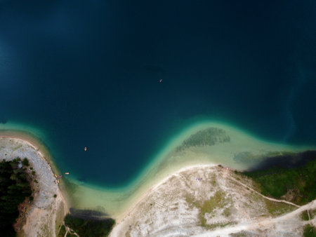 Amazing aerial drone view of Crno Jezero or Black lake, pine forest and cliffs in Durmitor national park, Zabljak, Montenegro. Travel, environment, beauty in nature, relaxing.の写真素材