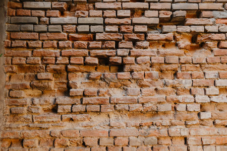 Old red brick wall. Brickwork from an old brick in a rustic style. Structure and pattern of the...