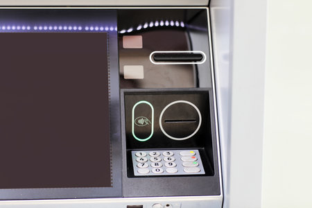 Automated teller machine details, ATM. Cashpoint keypad, NFC contactless wifi system, card reader and receipt printer. Finance, transactions, credit card, money withdrawal, currency, security banking.の写真素材