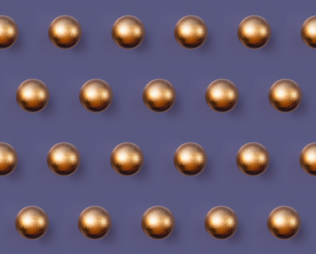 Golden Christmas ball pattern on violet background horizontal linesの写真素材