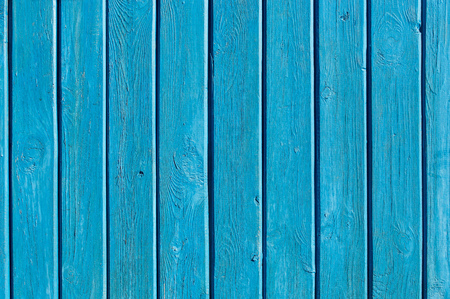 Aged aqua colored wooden gate with iron frameの写真素材