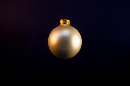 Pearl Christmas ball on the plane dark backgroundの写真素材
