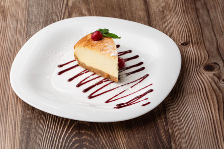 Cheesecake New York or classic cheesecake with caramel. close-up view. Tasty breakfast. Piece of...