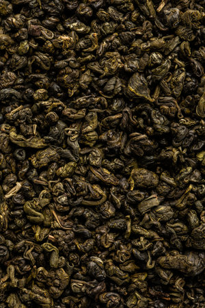 Heap of dry tea leaves. Dried green tea. Textured background of dried leaves of aromatic teaの写真素材