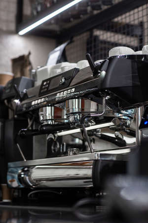 Close up of traditional Espresso Coffee Machine. Flowing fresh ground coffee. Drinking roasted black coffee in the morningの写真素材