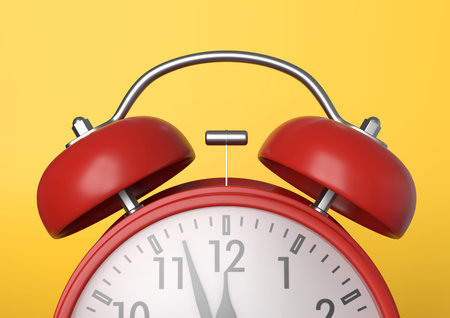 Red vintage alarm clock on bright yellow background in pastel colors. Minimal creative concept....