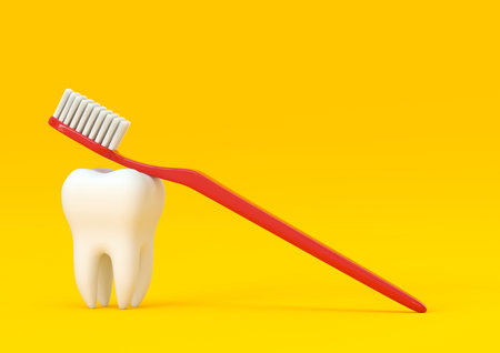 Toothbrush and white tooth on a yellow background. Concept of dental examination teeth, dental...