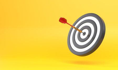 Dart hitting a target on the center on yellow background with copy space. Minimal concept. 3d render...