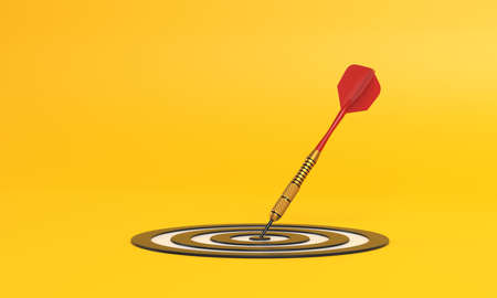Dart hitting a target on the center on yellow background with copy space. Minimal concept. 3d render illustrationの写真素材