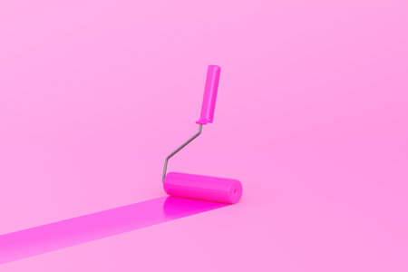 Pink Paint Roller with color trail over pink background. Home renovation or painting template with...