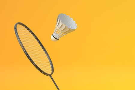 Badminton racket and shuttlecock on yellow background. 3d rendering illustrationの写真素材