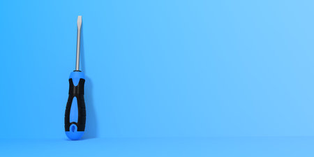 Screwdriver on a blue background with copy space. 3d rendering illustrationの写真素材