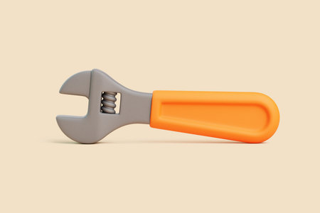 3D render of an adjustable wrench with an orange handle lying horizontally on beige background. Minimalist, clean, and realistic tool illustrationの写真素材