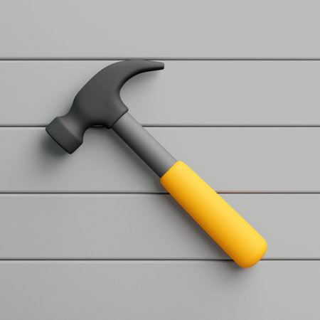 3D hammer with yellow handle lying on gray background, minimal design and clean compositionの写真素材
