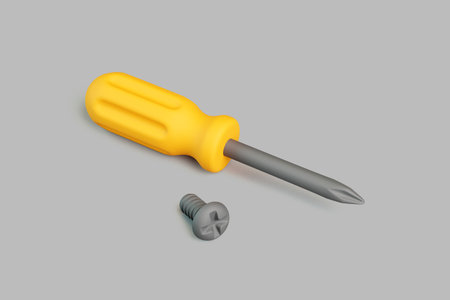 3D render of yellow screwdriver and metal screw on gray backgroundの写真素材