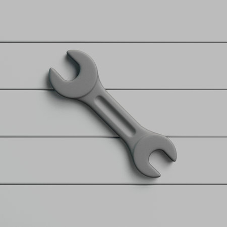 Realistic metal wrench placed on a gray wooden surface. Minimal 3D rendering of an open-end wrench...