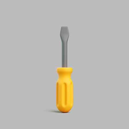 Realistic 3D flat screwdriver with yellow handle isolated on gray backgroundの写真素材
