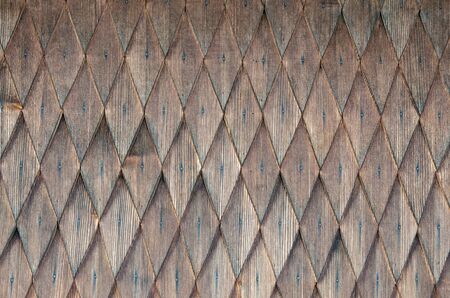 Background of successive rows of wooden rhombuses. Pattern of geometric figures of rhombus. Blank wooden background. Wood texture. Background from a wooden surface.の写真素材