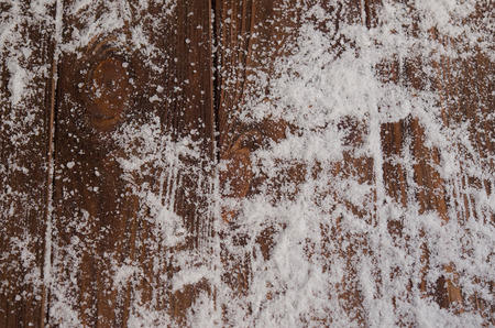 Crystals of ice on a natural wooden background. Winter background.の写真素材