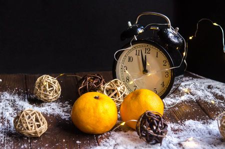 Crystals of ice on a natural wooden background. Christmas mood. Vintage watches and Christmas...