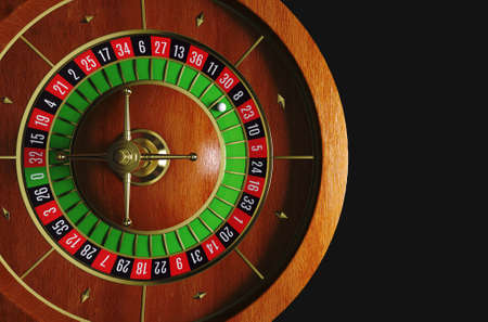 Roulette wheel. Roulette desk. Black background. 3D rendering.の写真素材