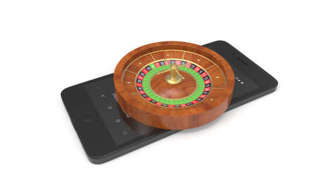Mobile phone with roulette and casino chips isolated on whiteの写真素材