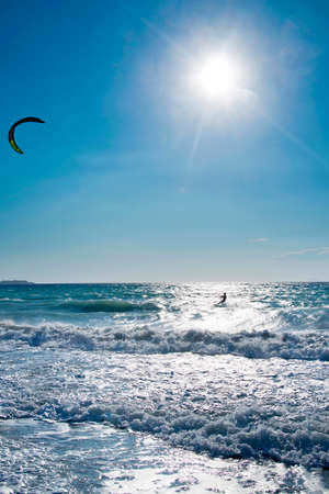Windsurfers on the sea shore Greece, Rhodes island . Surfers in the background of mountains in the distance. Summer sunny day.の写真素材