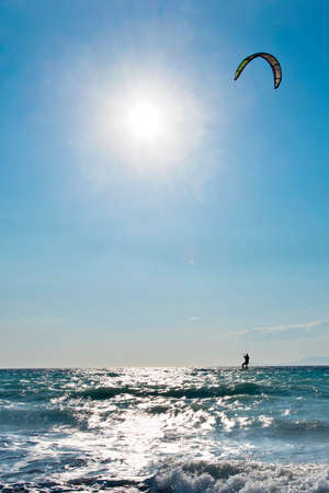 Windsurfers on the sea shore Greece, Rhodes island . Surfers in the background of mountains in the distance. Summer sunny day.の写真素材