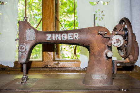 Black retro sewing machine in an old houseのeditorial素材