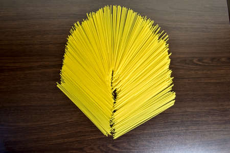 Mixed dried pasta selection on wooden background.の写真素材