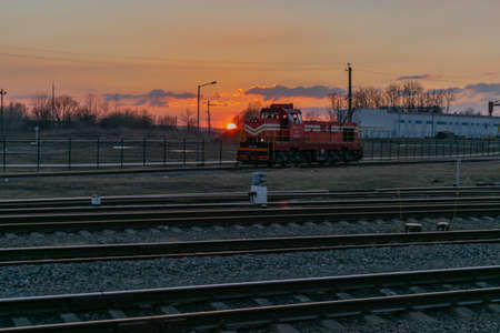new locomotive against the sky at sunset in spring Belarus station Kolyadichi March 31, 2019のeditorial素材