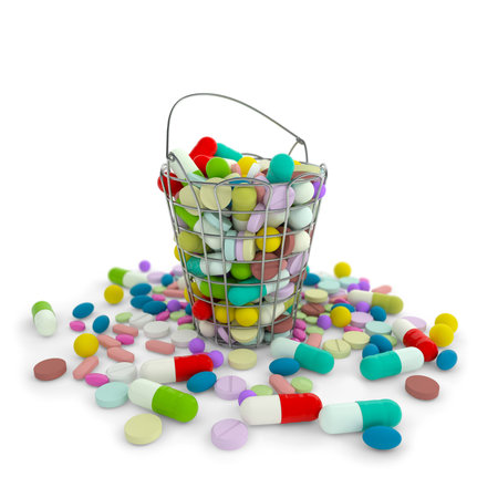 Heap of various drug pills capsules and tablets in iron basket container. Colorful pharmaceutical...