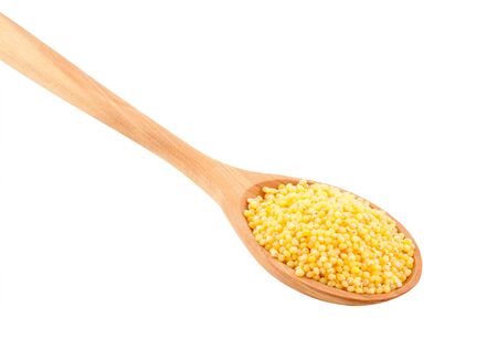 Millet in a wooden spoon on a white background.の写真素材
