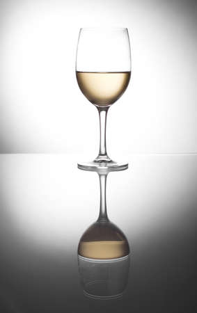 white wine glass with wineの写真素材