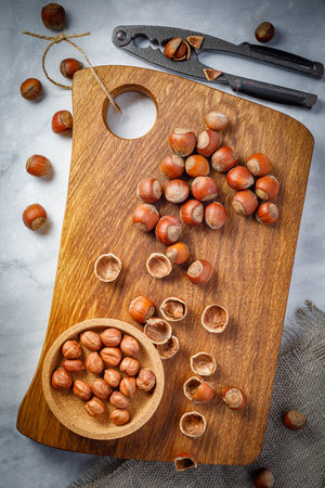 rustic style still life with hazelnuts and nutcrackerの写真素材