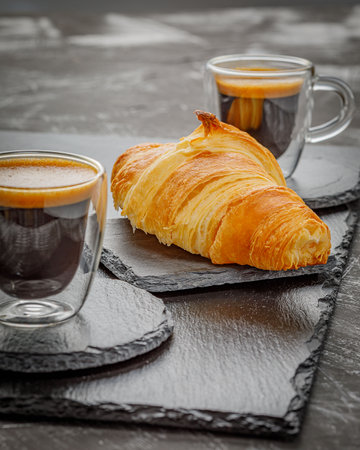 breakfast with coffee and growing on the stone boardの写真素材